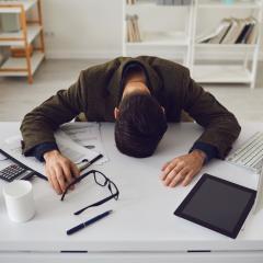 man stressed out at desk